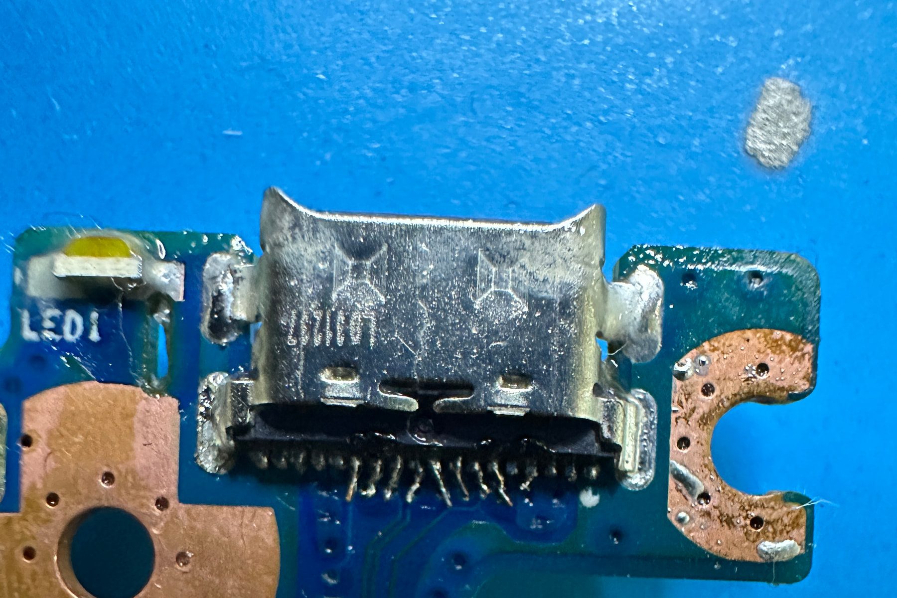 The same board after reconstruction, with a replacement connector fitted